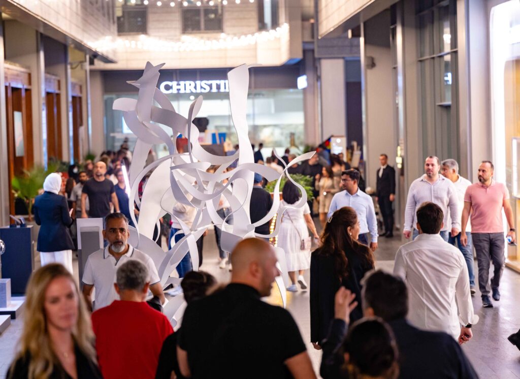 "Artists showcasing diverse artworks at DIFC Art Nights event"