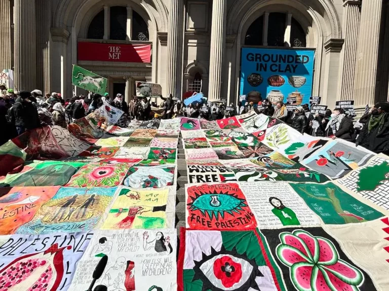 Pro-Palestine activists displaying "From Occupation to Liberation" quilt at the Metropolitan Museum of Art