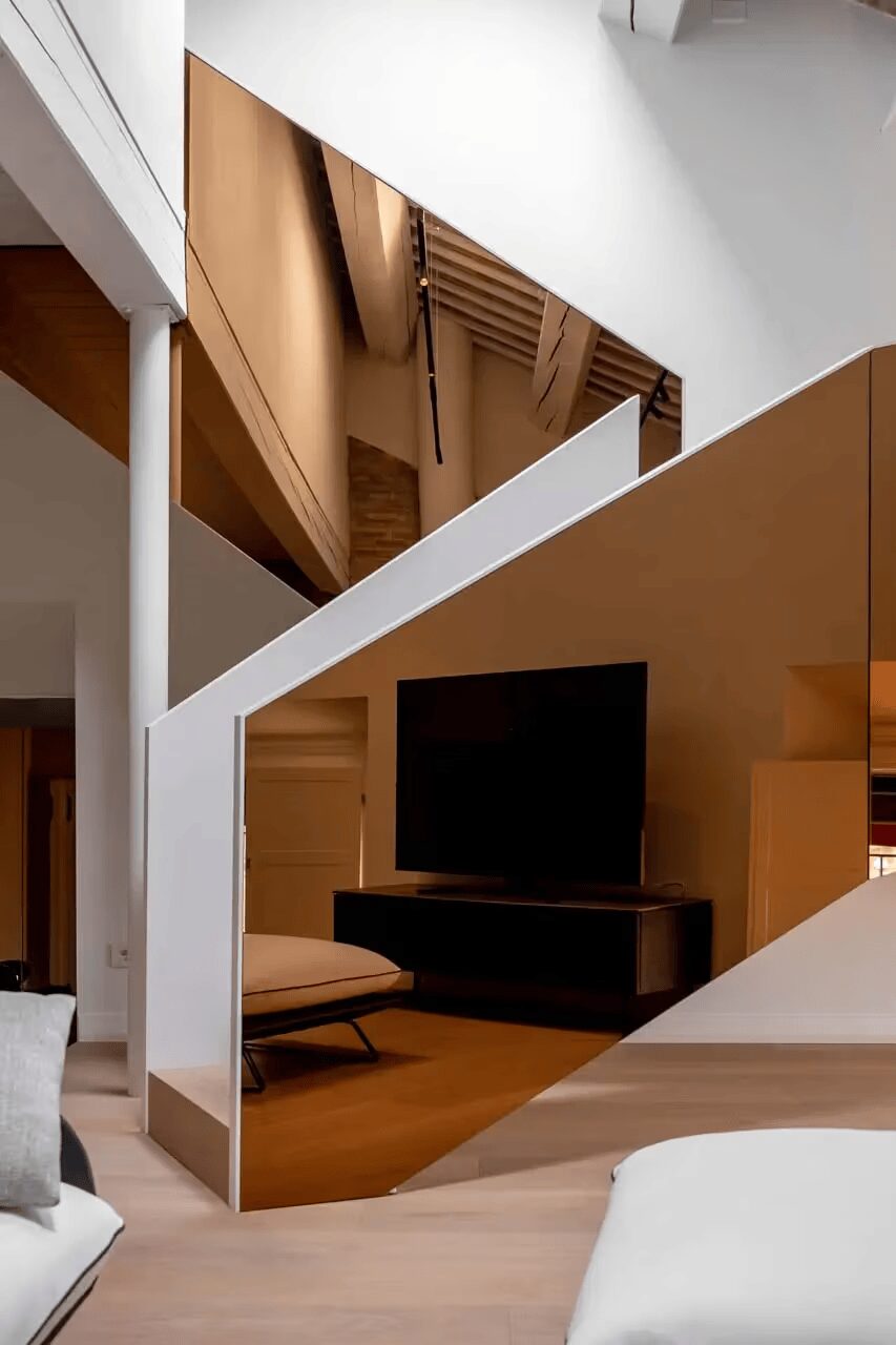 Photo inspiration: Penthouse Apartment With Hand Crafted Staircase Reference: Tissellistudioarchitetti Renovates Penthouse With Golden Staircase